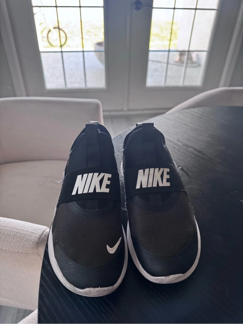 Nike Black Slip-On Sneakers with White Logo Accents